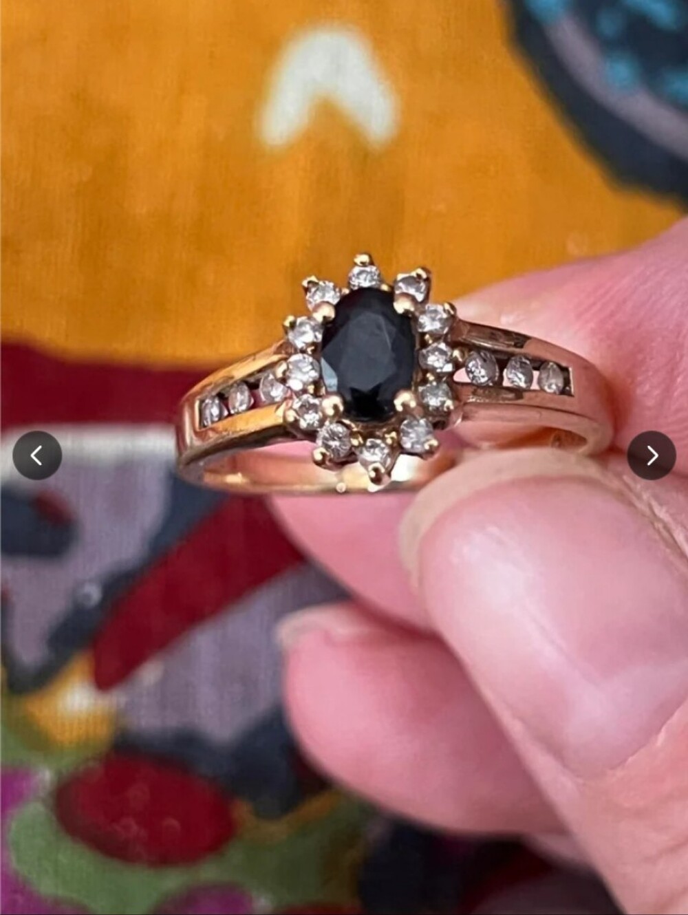 Gold Ring with Black Center Stone and Clear Accents